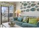 Relaxing living room with plush sofa, decorative pillows, and access to the balcony at 9620 Shore Dr. # 307, Myrtle Beach, SC 29572