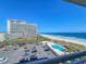 Overhead view displaying the pool, parking, beach, and ocean views from the condo at 9820 Queensway Blvd. # 607, Myrtle Beach, SC 29572