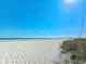 Expansive sandy beach with gentle waves offers a serene escape and endless opportunities for relaxation at 9820 Queensway Blvd. # 607, Myrtle Beach, SC 29572