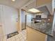 Functional kitchen with appliances, gray counters, and ample countertop space at 9820 Queensway Blvd. # 607, Myrtle Beach, SC 29572