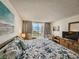 Inviting main bedroom featuring a sliding glass door, balcony, and ample closet space at 9820 Queensway Blvd. # 607, Myrtle Beach, SC 29572