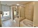 Bathroom featuring a soaking tub and glass enclosed shower at 9994 Beach Club Dr. # 408, Myrtle Beach, SC 29572