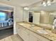 Bathroom with a granite countertop, double sinks and well-lit vanity area at 9994 Beach Club Dr. # 408, Myrtle Beach, SC 29572