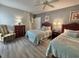 Bedroom showcasing two beds, decor, and a comfortable chair at 9994 Beach Club Dr. # 408, Myrtle Beach, SC 29572