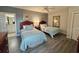 Bedroom includes two beds, decor, and a glimpse into the ensuite bathroom at 9994 Beach Club Dr. # 408, Myrtle Beach, SC 29572