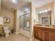 Full bathroom featuring a vanity with granite countertop, tiled floors, shower/tub, and decor at 9994 Beach Club Dr. # 706, Myrtle Beach, SC 29572