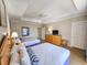 Bedroom featuring twin beds with wooden headboards, a dresser, and soft, neutral decor at 9994 Beach Club Dr. # 706, Myrtle Beach, SC 29572