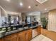 Open concept kitchen features granite counters, stainless appliances, and a breakfast bar with views of the dining and living areas at 9994 Beach Club Dr. # 706, Myrtle Beach, SC 29572