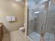 Bathroom featuring glass-enclosed shower, toilet, sink with granite countertop, and neutral wall color at 9994 Beach Club Dr. # 706, Myrtle Beach, SC 29572
