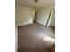 Spacious bedroom with neutral carpet, closet, and door leading to hallway at 1014 Mimosa Ct., Conway, SC 29527