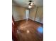 Bedroom features wood floors, a ceiling fan, neutral walls, and access to the hallway at 1014 Mimosa Ct., Conway, SC 29527
