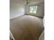 Carpeted bedroom with a large window offering natural light at 1014 Mimosa Ct., Conway, SC 29527