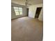 Spacious bedroom with natural light, a ceiling fan, and an open door to the bathroom at 1014 Mimosa Ct., Conway, SC 29527