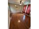 Bedroom with wood floors, ceiling fan, and large window with drapes at 1014 Mimosa Ct., Conway, SC 29527