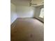 Carpeted bedroom with a ceiling fan and ample natural light from a window at 1014 Mimosa Ct., Conway, SC 29527
