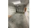 Spacious garage with overhead door, shelving, and ample room for storage at 1014 Mimosa Ct., Conway, SC 29527