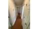Hallway with wood floors and white trim, connecting various rooms in the house at 1014 Mimosa Ct., Conway, SC 29527