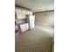 Traditional kitchen with white appliances, cabinets, and patterned wallpaper at 1014 Mimosa Ct., Conway, SC 29527