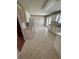 Traditional kitchen with white appliances, cabinets, and patterned wallpaper at 1014 Mimosa Ct., Conway, SC 29527