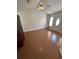 Open living room featuring wood flooring, a ceiling fan, and natural light from a front door window at 1014 Mimosa Ct., Conway, SC 29527
