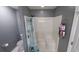 Bathroom featuring a stand-up shower, showerhead, floral shower curtain, and grey walls at 1210 Horry Rd., Aynor, SC 29511