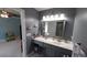Stylish bathroom with gray walls, a vanity with lots of counter space, and modern fixtures at 1210 Horry Rd., Aynor, SC 29511