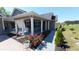 Inviting home exterior featuring a covered porch with white columns and colorful flower beds at 1210 Horry Rd., Aynor, SC 29511