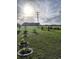 Landscaped front yard featuring ornamental trees, bushes, and well-maintained lawn at 1210 Horry Rd., Aynor, SC 29511