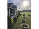 Charming home featuring a welcoming front porch, lush landscaping, and a well-manicured lawn at 1210 Horry Rd., Aynor, SC 29511