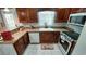 Well-equipped kitchen with stainless steel appliances and dark wood cabinetry at 1210 Horry Rd., Aynor, SC 29511