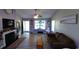 Inviting living room featuring hardwood floors, a fireplace, and plenty of natural light at 1210 Horry Rd., Aynor, SC 29511