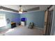 Large main bedroom featuring a ceiling fan and a barn door leading to the closet at 1210 Horry Rd., Aynor, SC 29511