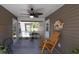 Screened in porch with rocking chair and fan at 1210 Horry Rd., Aynor, SC 29511