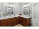 Spacious bathroom featuring double sinks with wooden cabinets, large mirrors, and great lighting at 1406 Seabrook Plantation Way, North Myrtle Beach, SC 29582