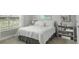 Comfortable bedroom featuring a light-colored bed, plush carpet, and bright, neutral walls at 1406 Seabrook Plantation Way, North Myrtle Beach, SC 29582