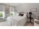 Comfortable bedroom features a decorative wrought iron bed frame, neutral walls, and plush carpet at 1406 Seabrook Plantation Way, North Myrtle Beach, SC 29582