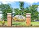 Seabrook Plantation entrance sign featuring brick columns, stone accents, and lush green landscaping at 1406 Seabrook Plantation Way, North Myrtle Beach, SC 29582