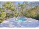 Inviting community hot tub surrounded by a stone patio and lush landscaping at 1406 Seabrook Plantation Way, North Myrtle Beach, SC 29582