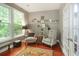 The living room showcases two chairs, a small table, and a large window at 1406 Seabrook Plantation Way, North Myrtle Beach, SC 29582