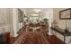 Open-concept living area with hardwood floors, fireplace, built-ins, and ample seating at 1406 Seabrook Plantation Way, North Myrtle Beach, SC 29582