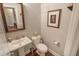 Cozy powder room with pedestal sink, framed mirror, and elegant decor at 1406 Seabrook Plantation Way, North Myrtle Beach, SC 29582