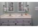 Bright bathroom with double sinks, white cabinets, and modern fixtures at 2001 S Ocean Blvd. # 207, Myrtle Beach, SC 29577