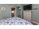 This bedroom offers a comfortable bed, dresser, and TV at 2001 S Ocean Blvd. # 207, Myrtle Beach, SC 29577