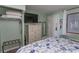 This bedroom offers a comfortable bed, dresser, and TV at 2001 S Ocean Blvd. # 207, Myrtle Beach, SC 29577