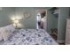 This bedroom offers a comfortable bed, dresser, and access to the kitchen at 2001 S Ocean Blvd. # 207, Myrtle Beach, SC 29577