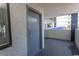 Condo entry door with exterior hallway and concrete finishes and door number 207 at 2001 S Ocean Blvd. # 207, Myrtle Beach, SC 29577
