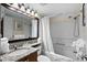 Bathroom featuring granite countertop, toilet, shower with curtain, and fluffy towels at 2701 N Ocean Blvd. # 1154-60, Myrtle Beach, SC 29577