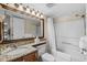 Well-lit bathroom with granite vanity, large mirror, and shower-tub combo at 2701 N Ocean Blvd. # 1154-60, Myrtle Beach, SC 29577