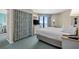 Relaxing bedroom featuring a comfortable bed, ocean view balcony, and soothing decor at 2701 N Ocean Blvd. # 1154-60, Myrtle Beach, SC 29577