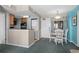 A dining area offers a table for four, nearby kitchen, and an in-unit washer/dryer at 2701 N Ocean Blvd. # 1154-60, Myrtle Beach, SC 29577